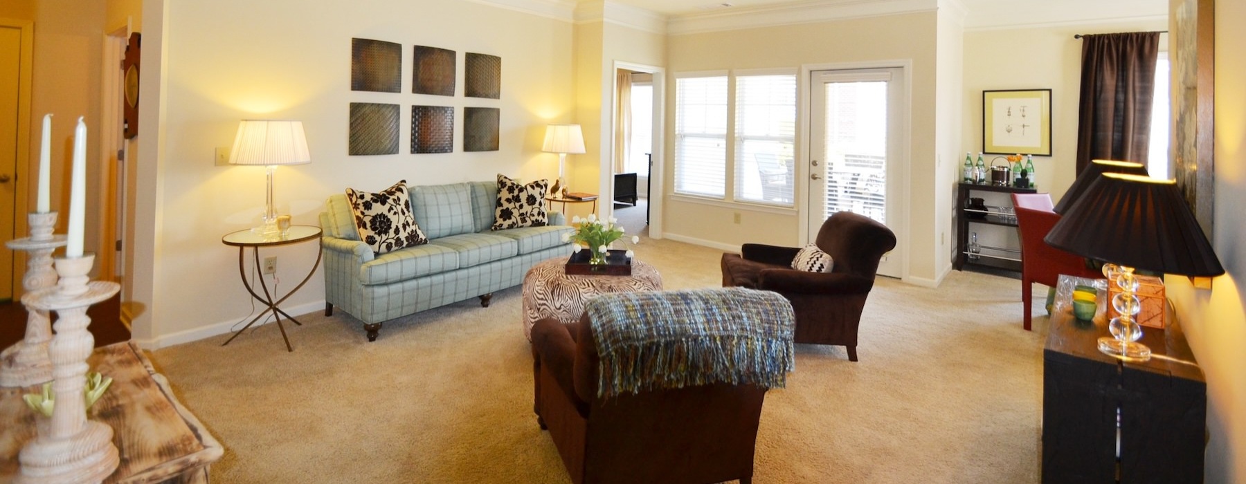 a living room with a couch and chairs