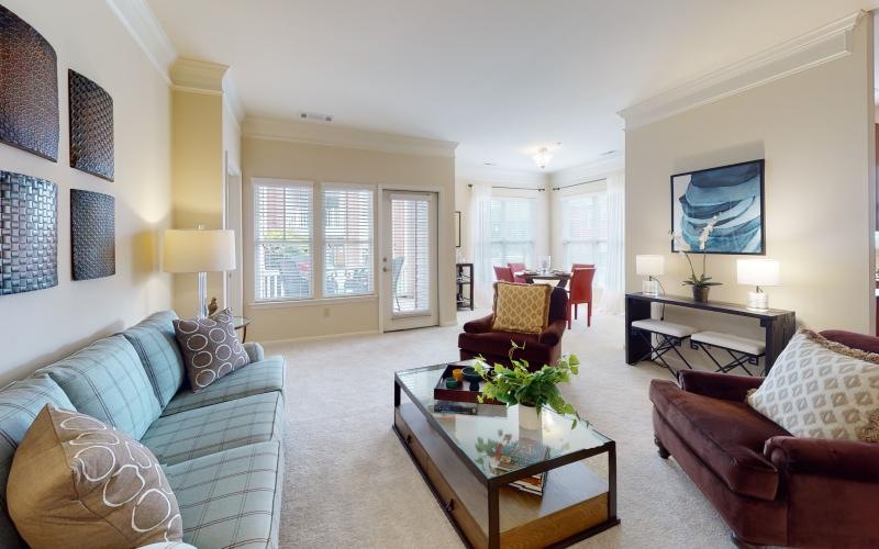 a living room with a tv and couches